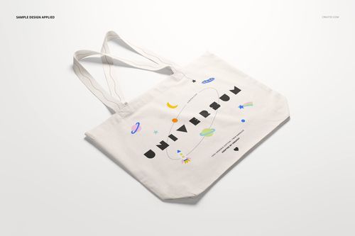Weekender tote bag mockup displayed at an angle, showing a white bag with colorful space illustrations and bold lettering.