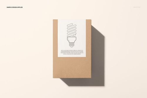 PSD mockup of a tall cardboard box with a white sticker and line art bulb design, presented in a flat lay perspective.