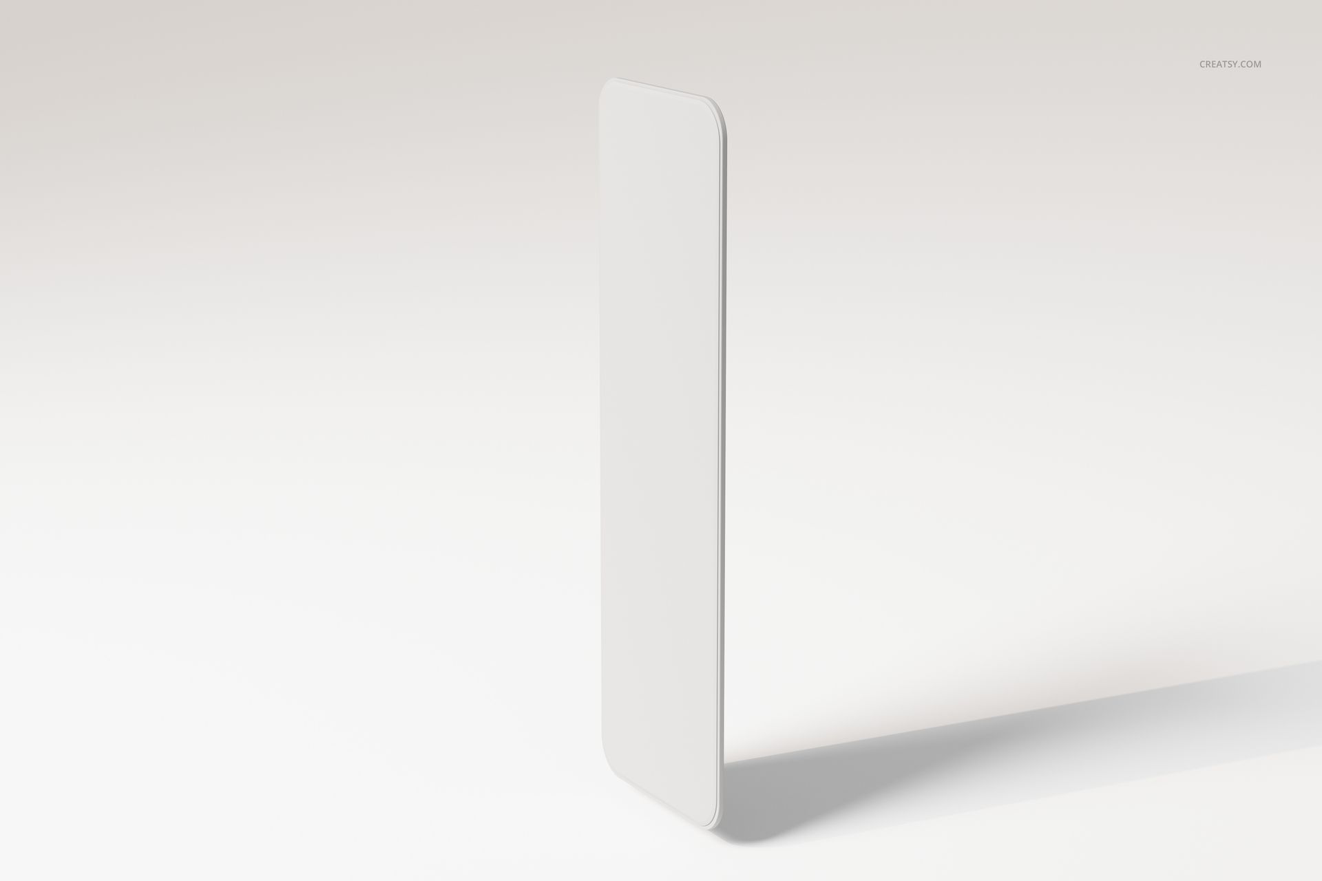 Rectangular wall mirror with rounded corners shown standing upright on a light, neutral background with soft shadows.