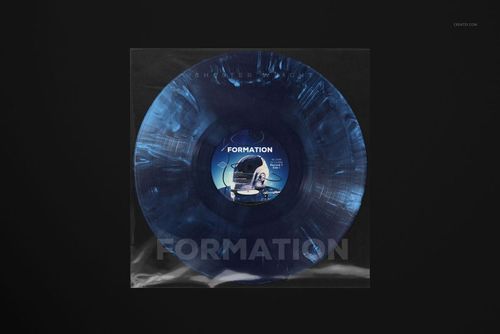 PSD mockup showing a blue vinyl record with swirling patterns in a transparent sleeve, centered on a dark surface.