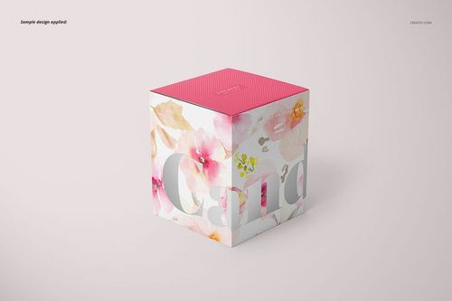 Mockup of a floral-patterned candle box with matte glass effect, pink top, and soft pastel colors, front perspective.