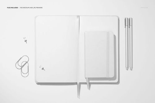 PSD mockup showing two open leather calendars with minimalistic white covers, accompanied by pens and office supplies.