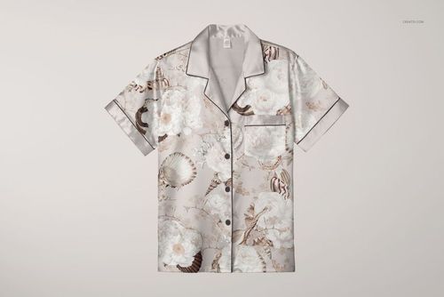 Silk short-sleeve pyjama top mockup featuring a floral and seashell pattern, shown from the front on a plain background.