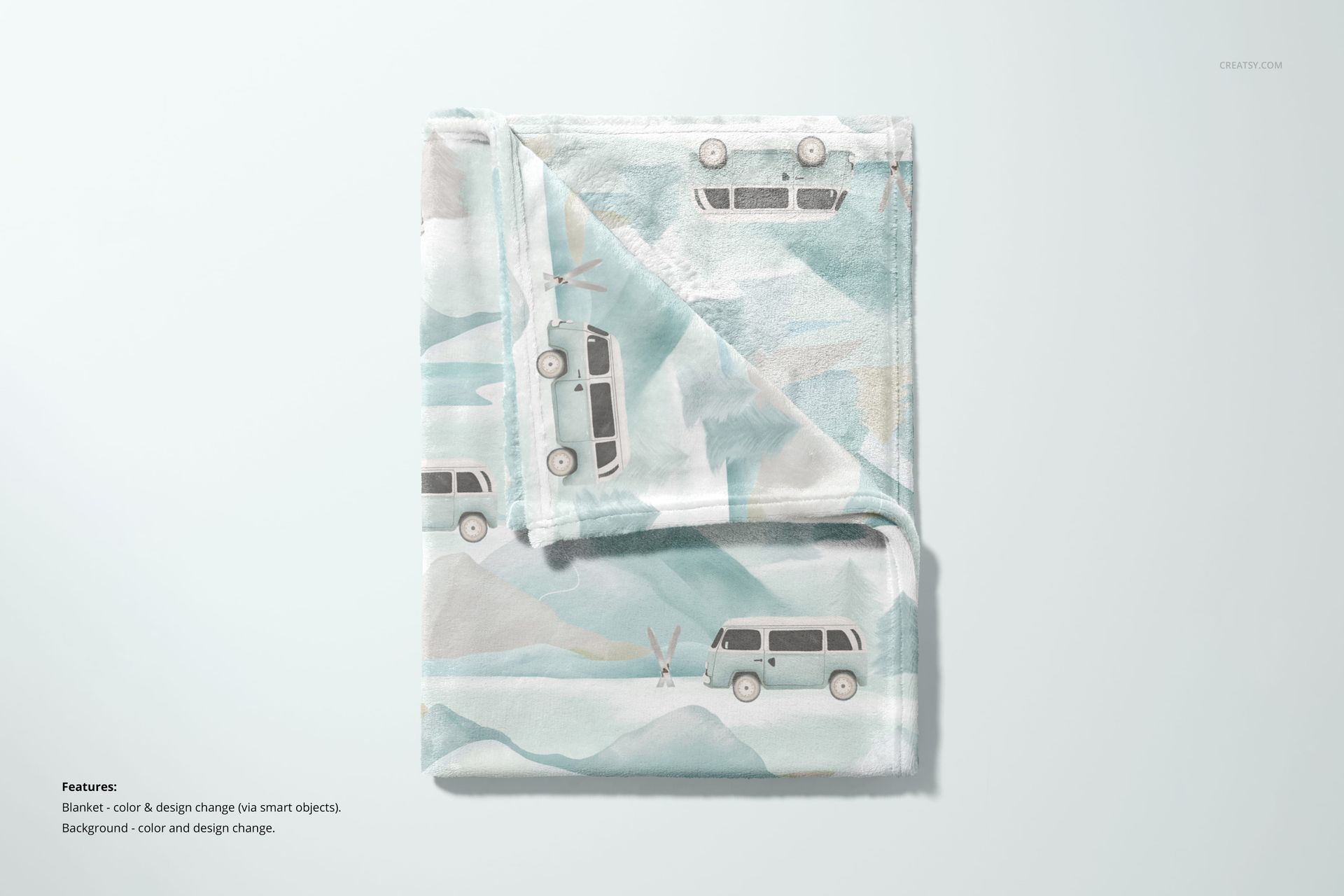 Top view of a 30x40 fleece blanket mockup featuring soft watercolor mountains and cartoon vans, neatly folded.