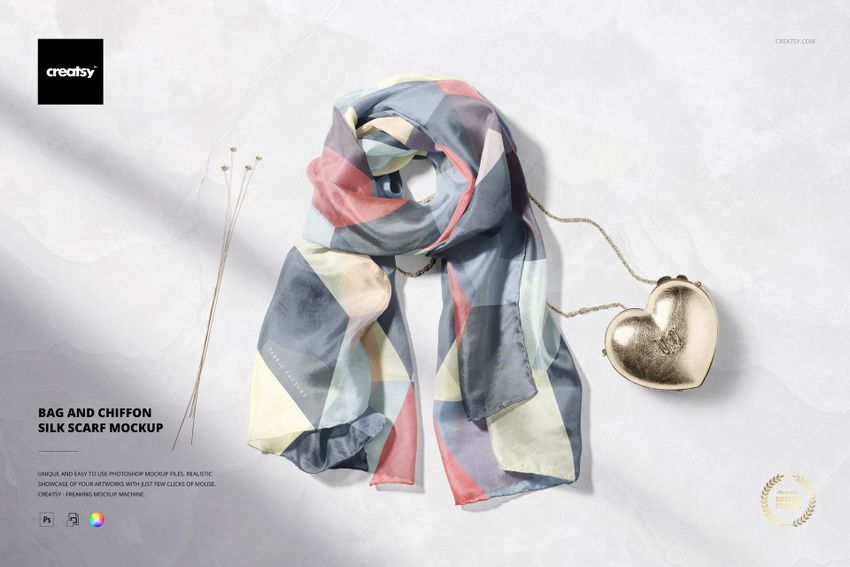 Chiffon silk scarf mockup with abstract pastel geometric pattern, displayed next to a metallic heart-shaped bag on a light surface.