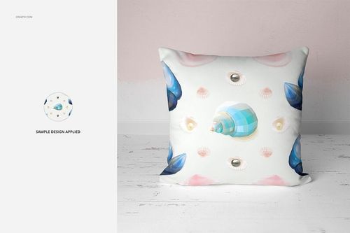 Front-facing mockup of a square pillow featuring a pastel seashell design, placed against a pale pink wall.