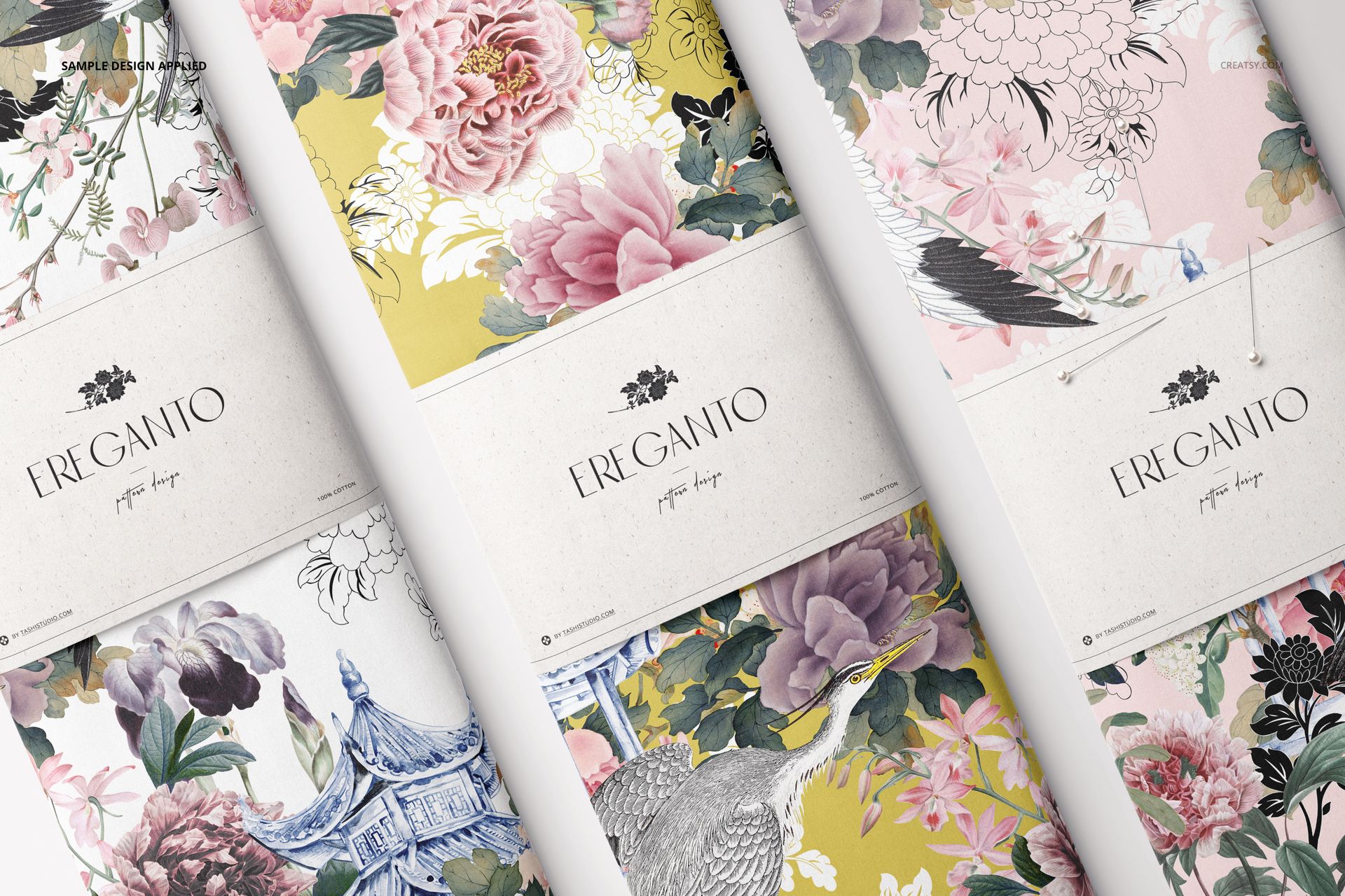 Fabric bolt mockup featuring intricate flower and crane motifs in soft pink, yellow, and green, top-down perspective.