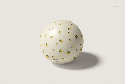 Beach ball mockup featuring a cream-colored surface decorated with small yellow lemons, viewed from above.