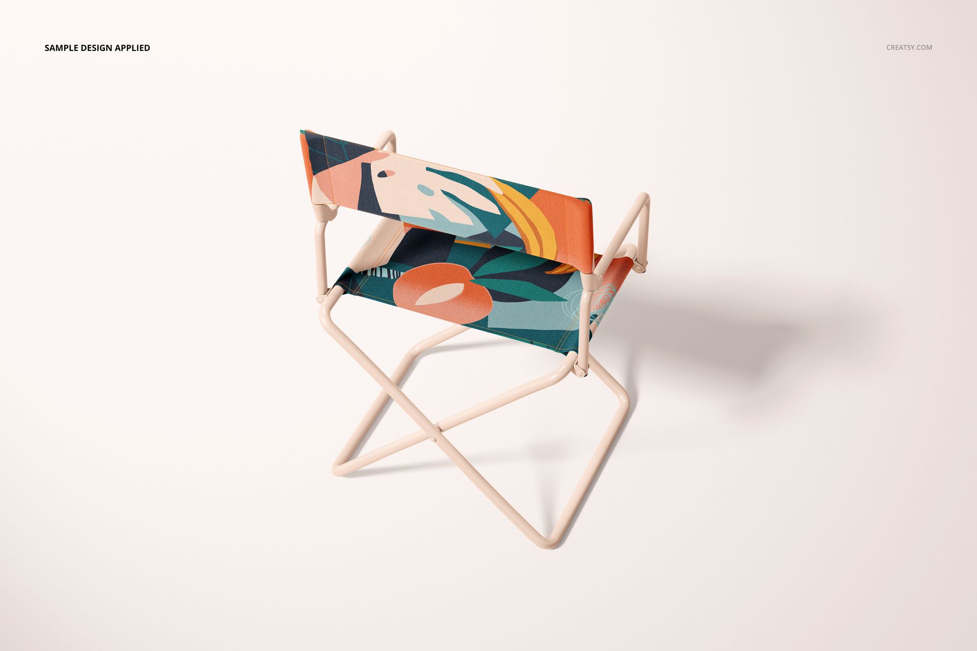 PSD mockup of a folding directors chair featuring geometric and organic shapes in vibrant colors, angled from above.