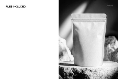 Front view of a matte paper doypack mockup placed on a stone platform with dramatic lighting and shadows.