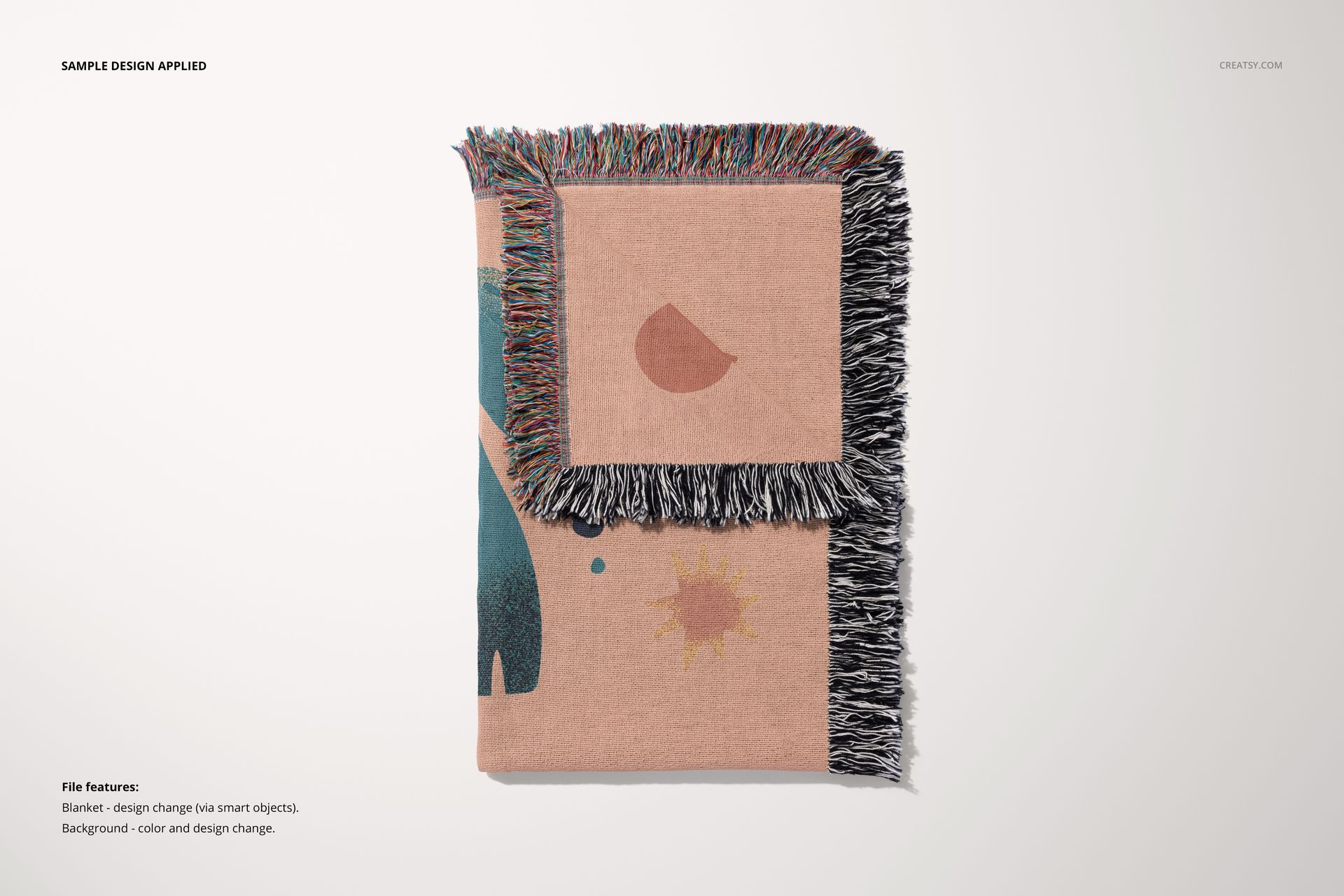 Front view of a folded woven throw blanket mockup featuring colorful fringes and abstract shapes on a light surface.