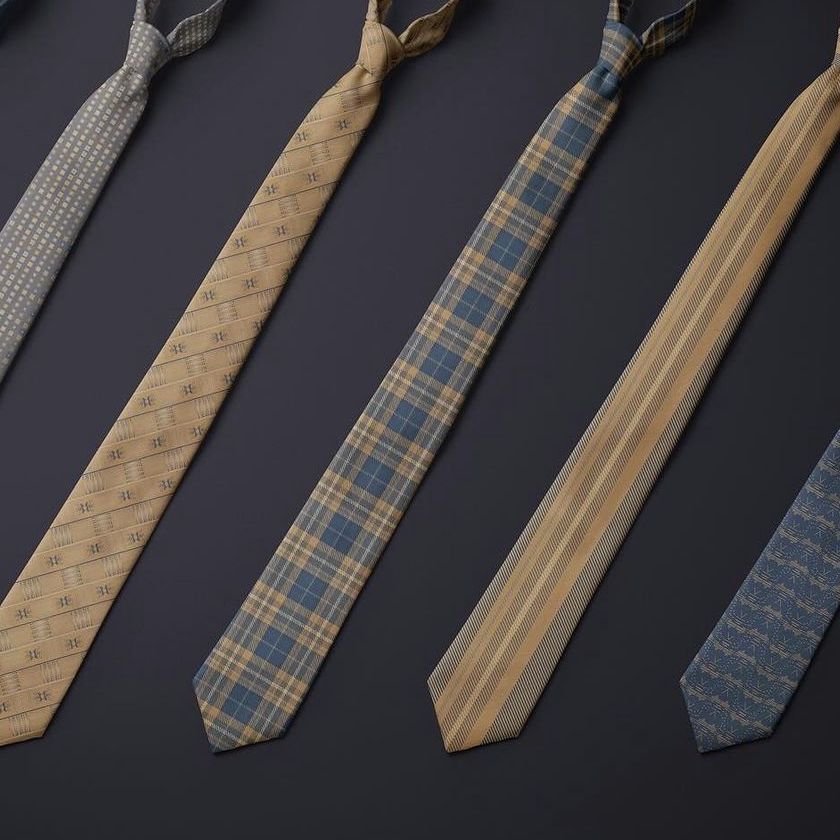 Tie mockup set featuring five patterned neckties arranged diagonally on a dark surface, each with a distinct design and color.