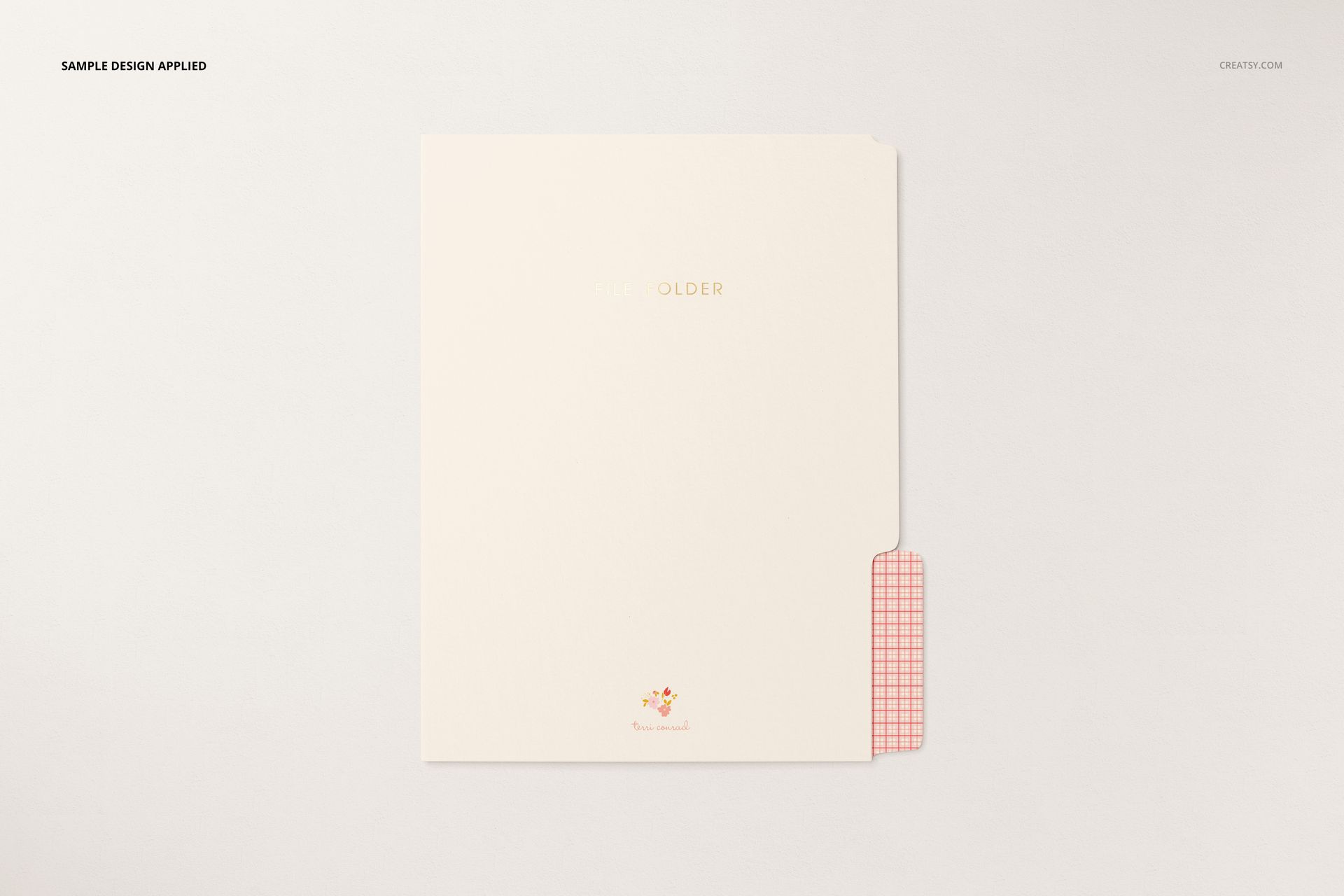 Stationery folder mockup featuring a minimalist cream cover, red checkered tab, and subtle floral accent below.