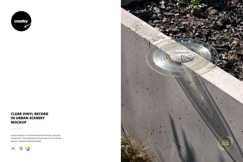 PSD mockup of a clear vinyl record on a concrete edge with soil and plants, illuminated by natural light.