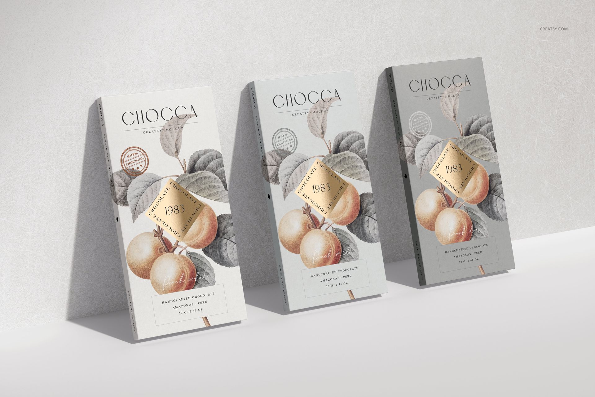 Three chocolate bar packaging mockups displayed upright, featuring botanical fruit illustrations and neutral backgrounds.