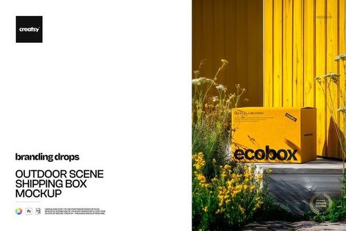 Rectangular yellow shipping box mockup placed outdoors next to blooming yellow flowers and a yellow wall.