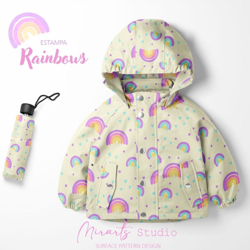 Kids rainwear mockup featuring a light-colored hooded jacket and matching umbrella cover with a colorful rainbow pattern on a white background.