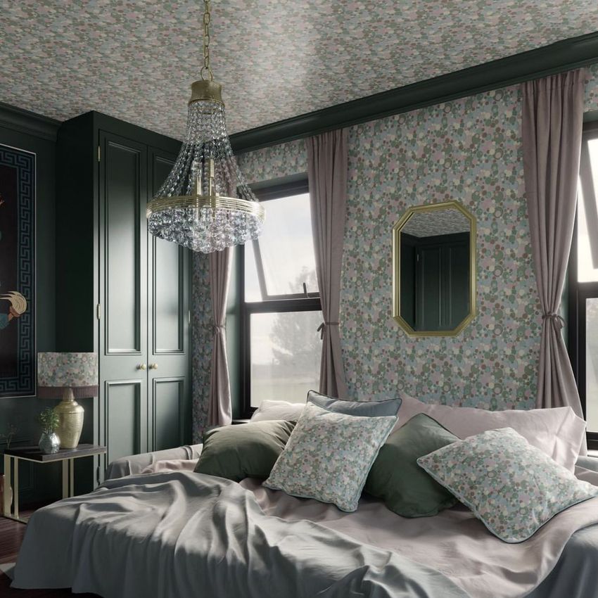 Bedroom mockup featuring a large bed with layered pillows and blankets, floral wallpaper on walls and ceiling, and a chandelier.