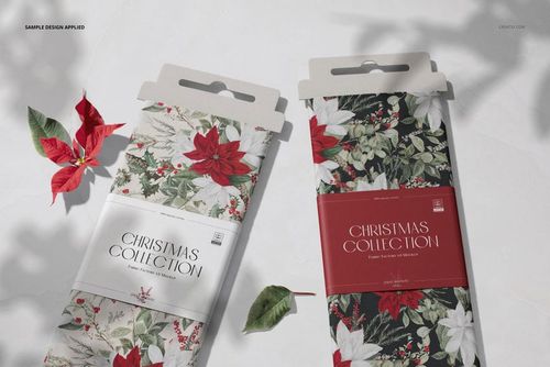 Front view of two fabric bolts mockup featuring festive floral designs, packaging labels, and scattered leaves.
