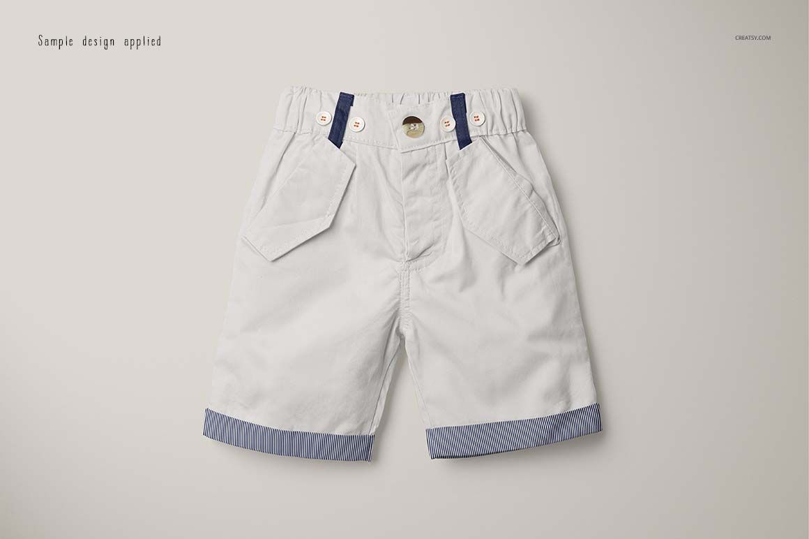 Front view of boys formal shorts mockup with white fabric, blue accents, and striped trim on a neutral background.