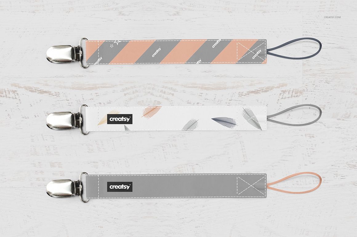Three pacifier clip mockups in various pastel designs, displayed horizontally with metal clasps and fabric loops.