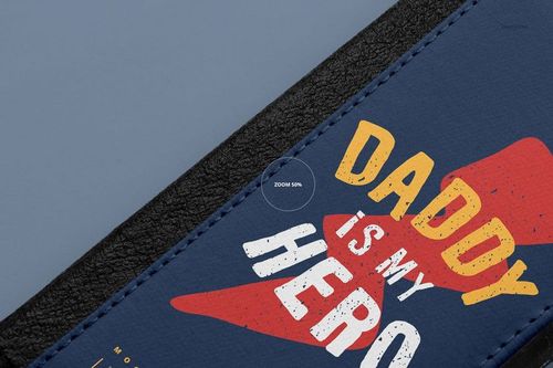 Close-up of a foldable iPhone X case mockup with a textured black edge and blue cover featuring bold text and graphics.