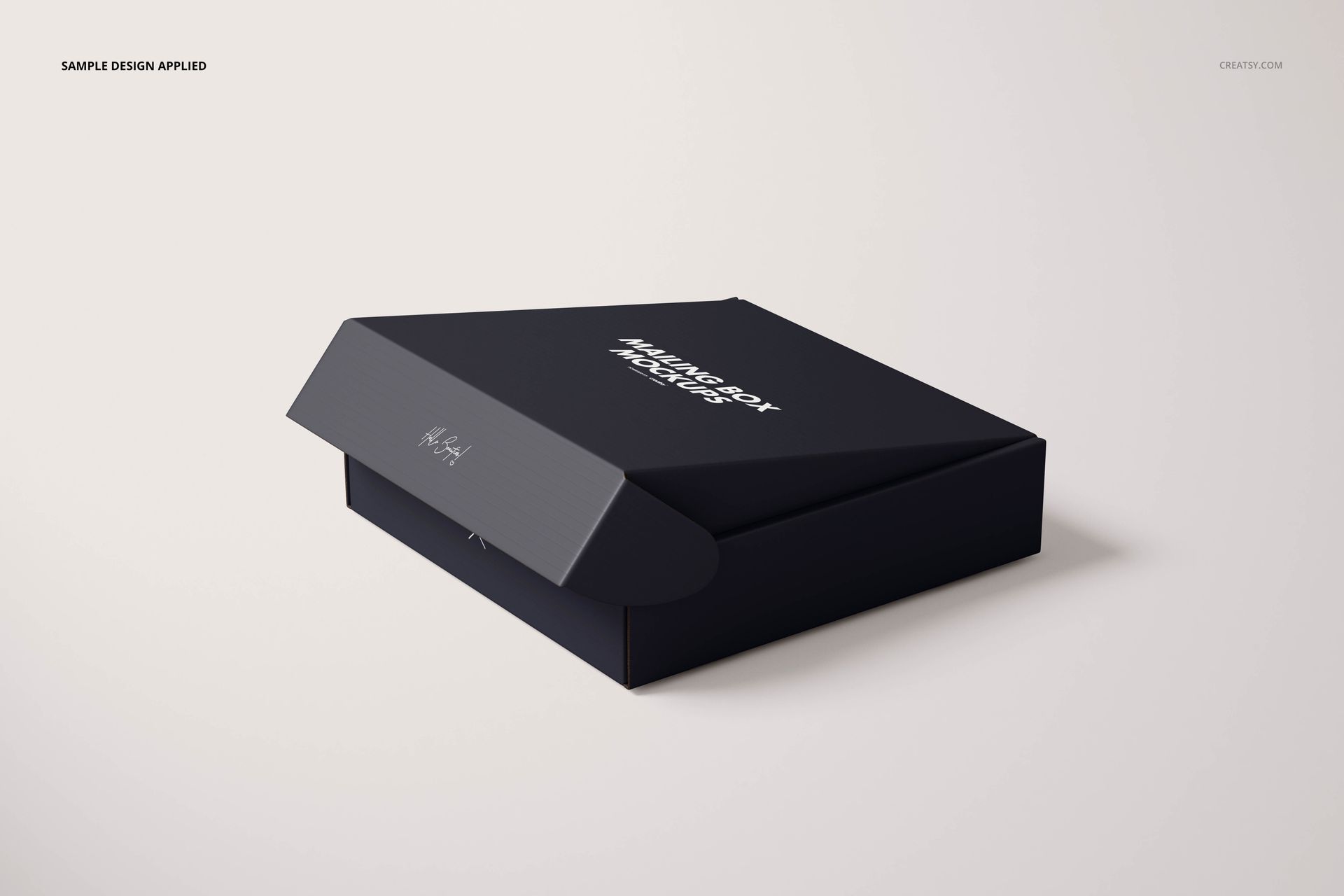 Rectangular mailing box mockup in dark color, shown from a front angle with lid partially open on a light background.