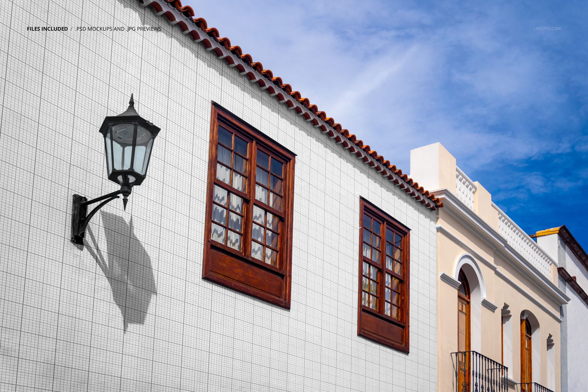Old town street mural PSD mockup showing a building facade with grid pattern, wooden framed windows, and lamp.