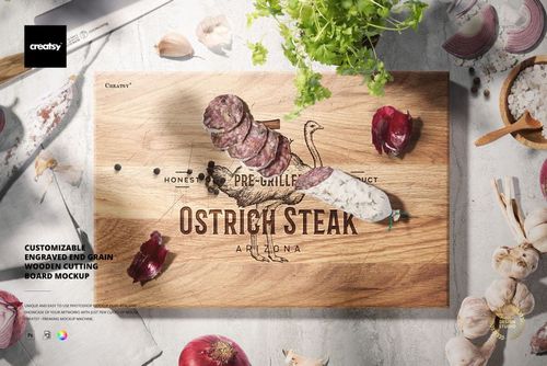 Top view of a rectangular end grain wooden cutting board mockup with engraved text, surrounded by vegetables and herbs.