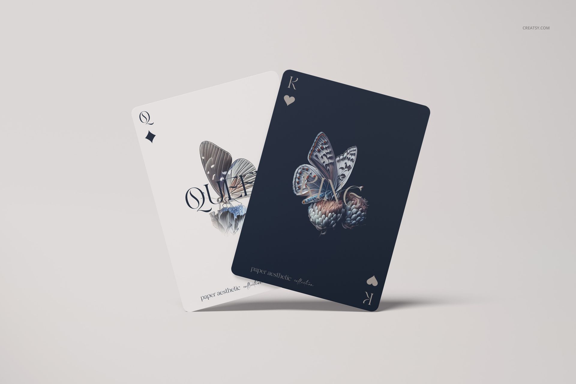 Queen and king playing cards with butterfly artwork, shown in a clean mockup scene with light and dark card backgrounds.