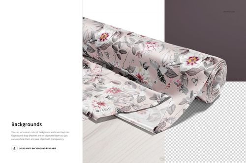 PSD mockup of a satin fabric roll featuring a delicate floral design, displayed partially unrolled on a wooden tabletop.