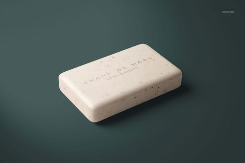 Single rectangular hand soap bar with light beige color and speckled pattern, shown in a hotel supplies PSD mockup.