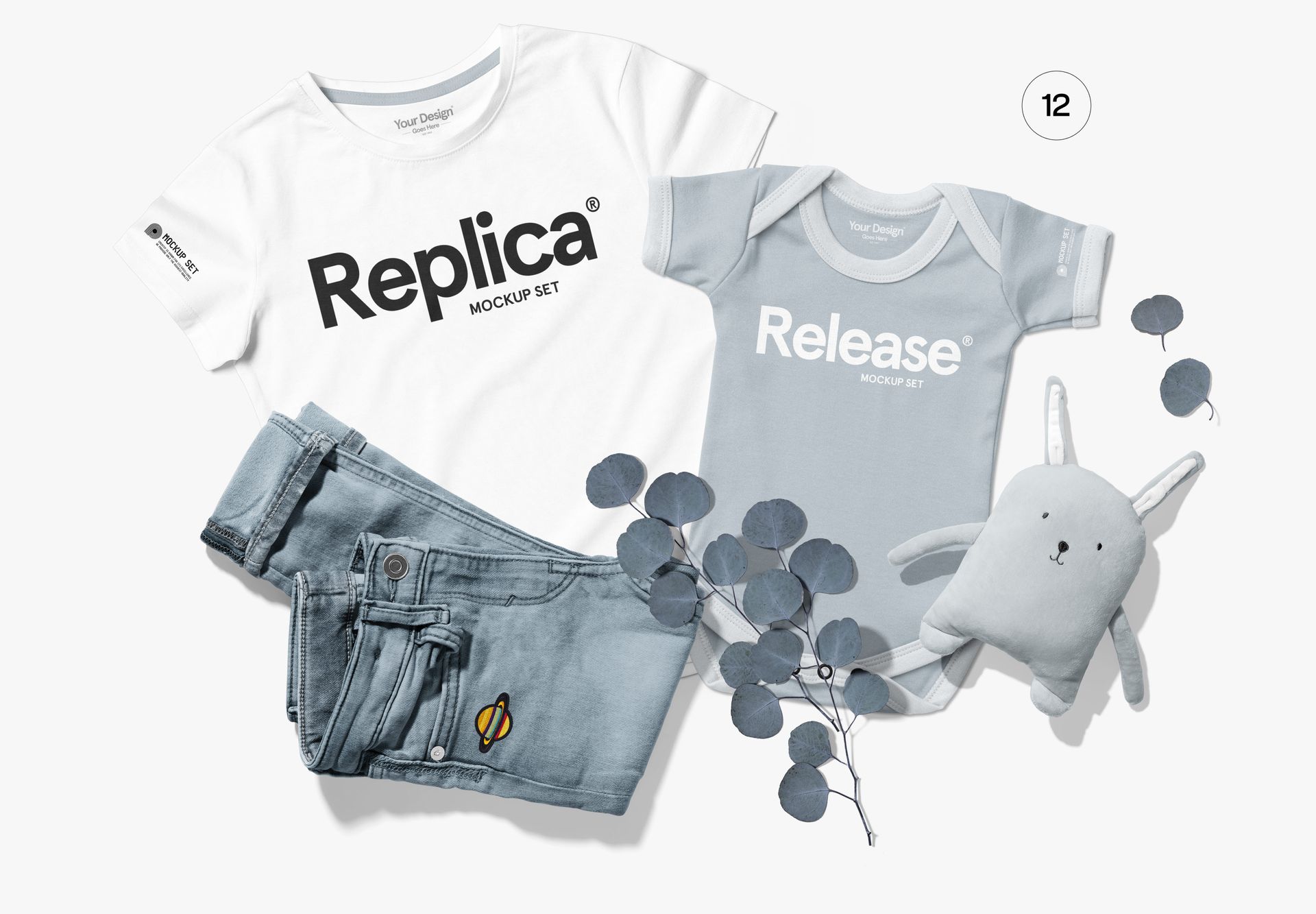 Flat lay of a Bella Canvas 3001 family apparel mockup with adult t-shirt, baby bodysuit, jeans, and soft toy on white background.