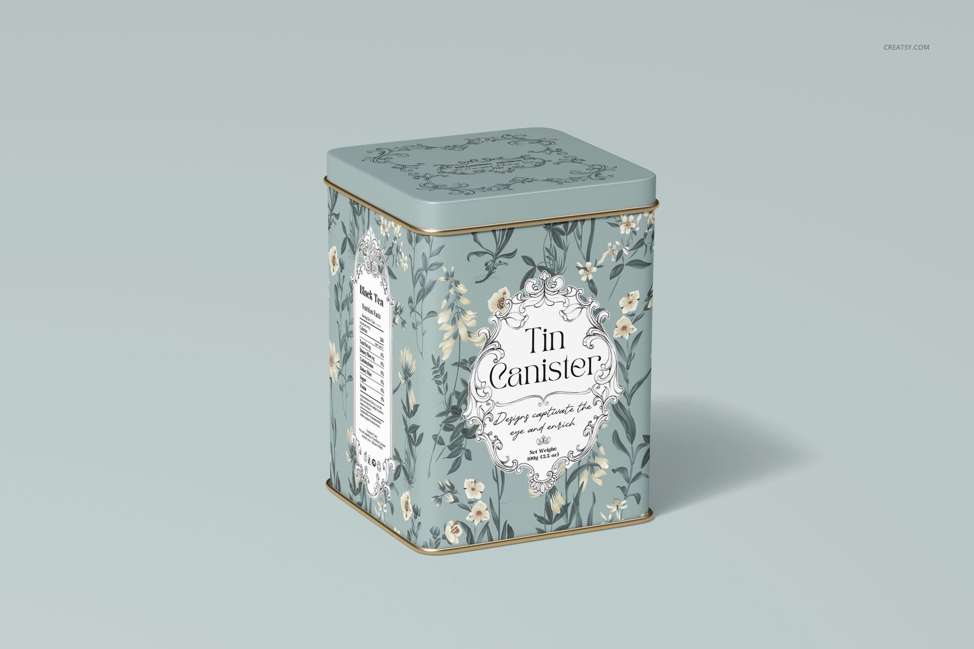 Floral patterned tin canister mockup in blue and cream colors, displayed at a three-quarter angle on a pale surface.