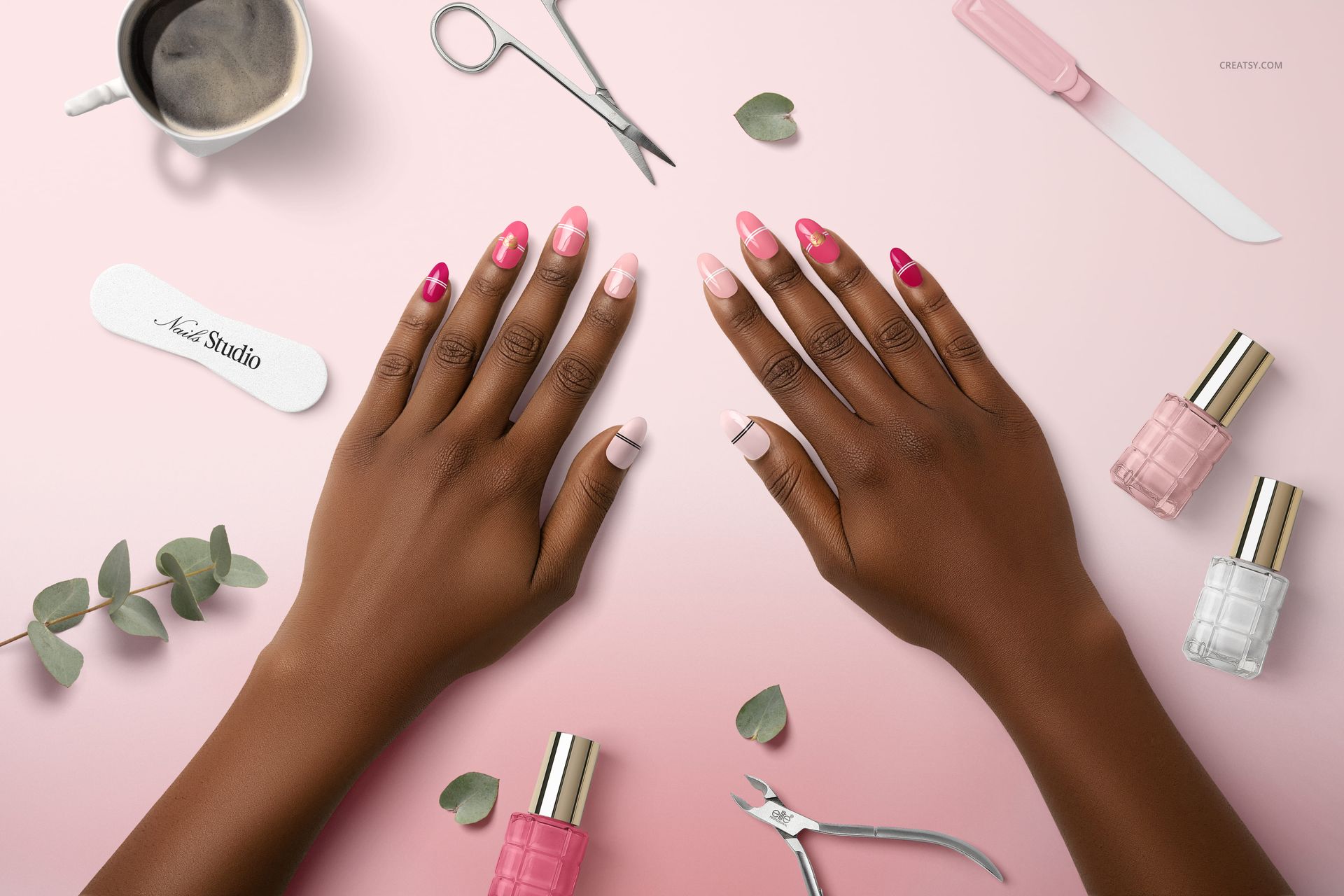 PSD mockup showing manicured hands with pink nail art, nail care tools, and polish bottles on a soft pink background.