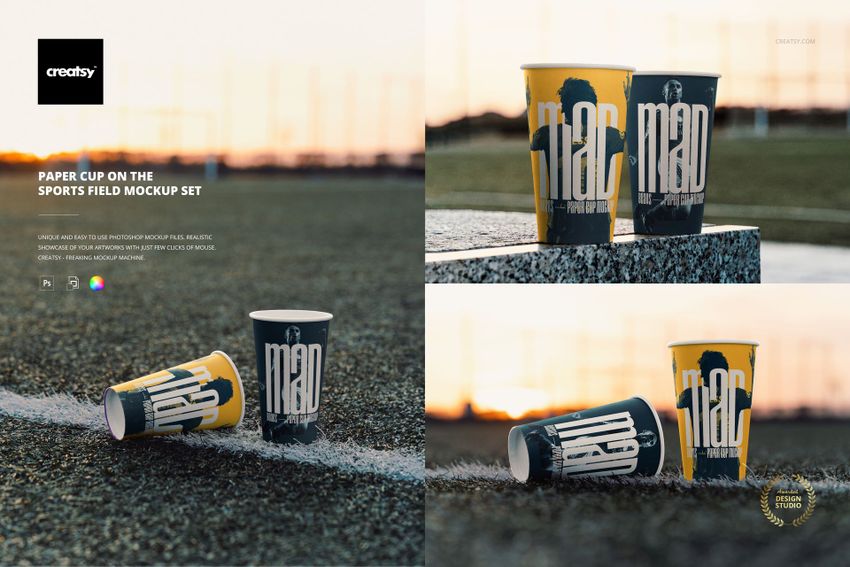 PSD mockup featuring paper cups with graphic prints and lids, arranged on a sports field with blurred background fencing.