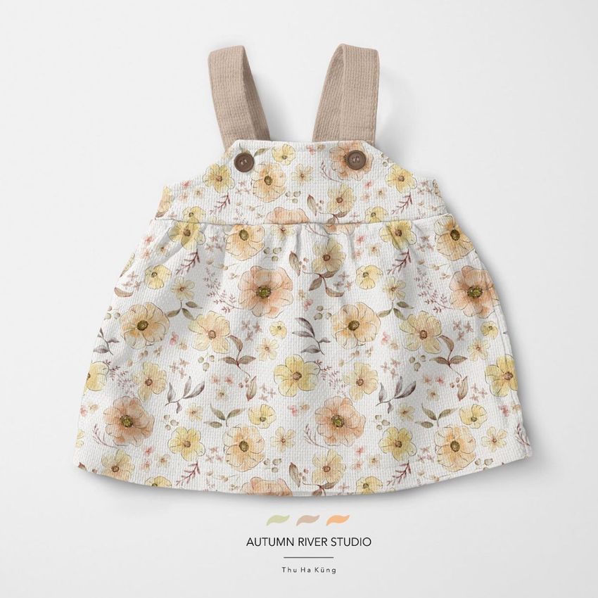 Baby dress mockup featuring a sleeveless dress with beige straps and a yellow floral pattern, displayed on a light background.