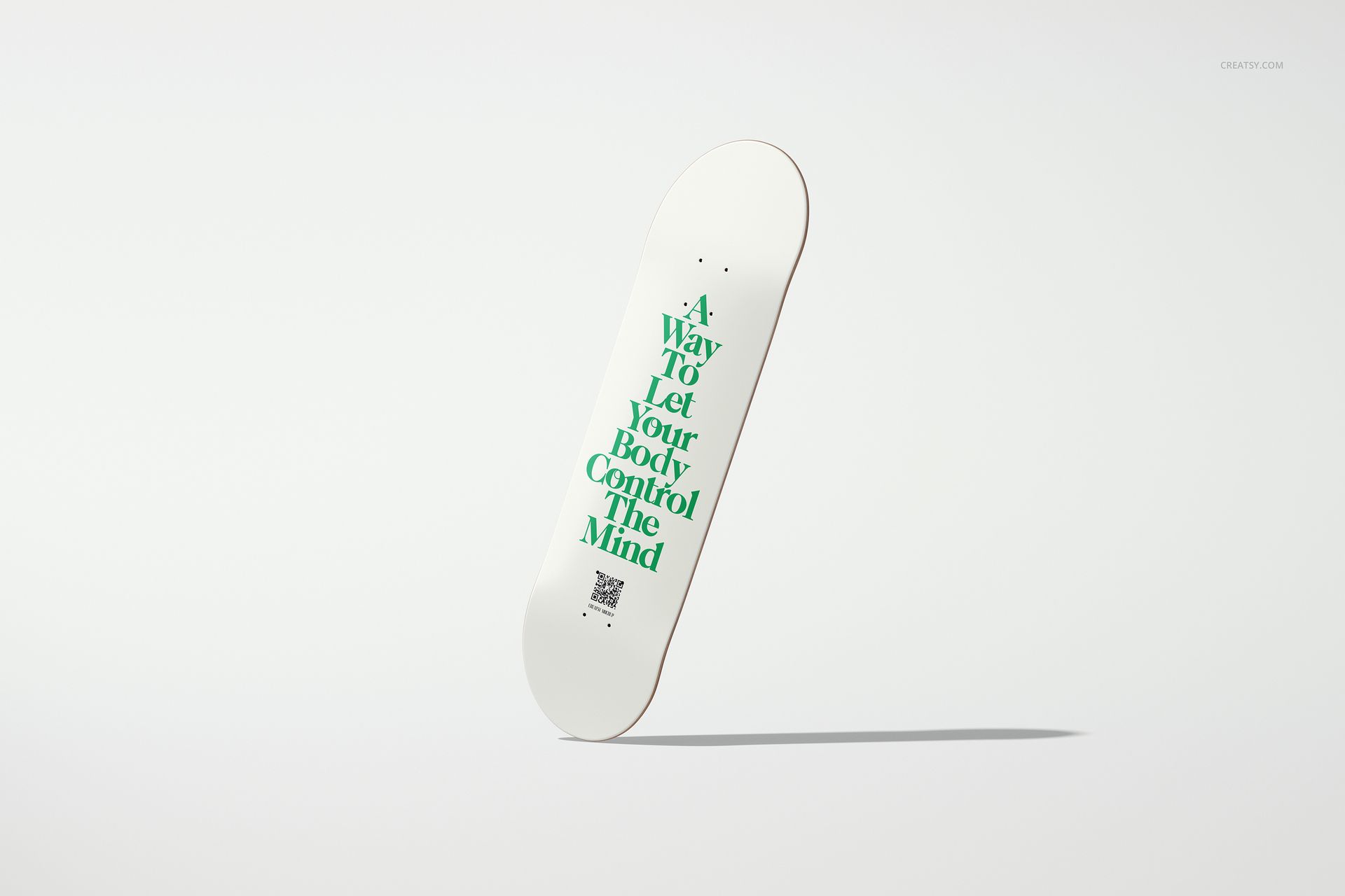 Minimalist skateboard deck mockup with green lettering, presented diagonally on a clean, neutral background.