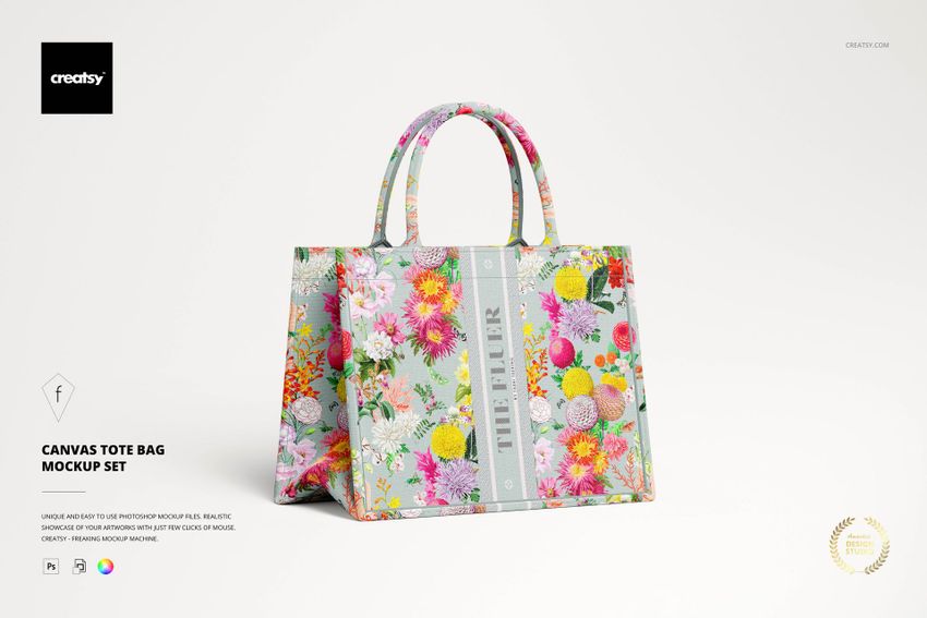 PSD mockup of a canvas tote bag featuring vibrant flower designs and sturdy handles, set against a white backdrop.