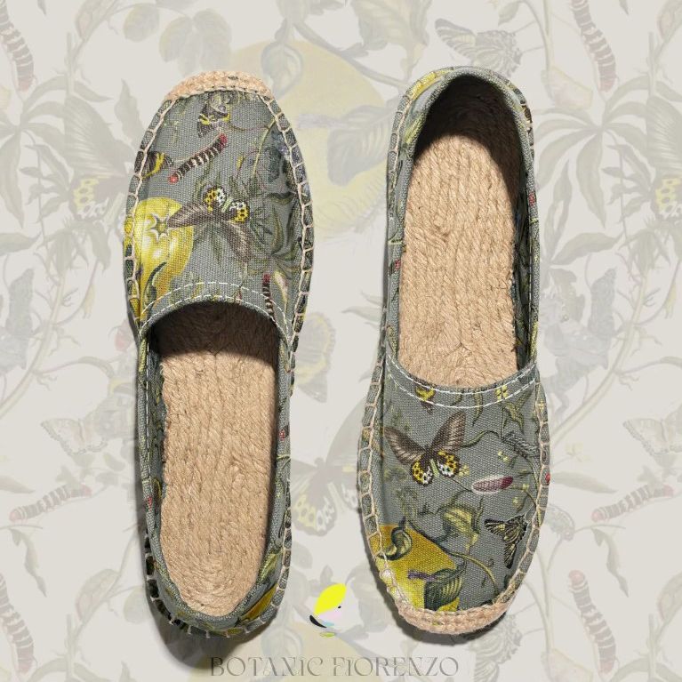 Canvas espadrilles mockup featuring a pair of shoes with a botanical and butterfly pattern on a neutral background.