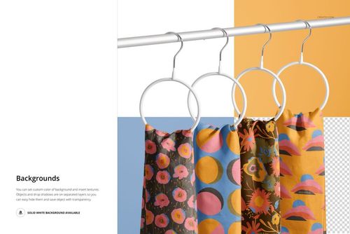 Four silk scarves with colorful floral and geometric patterns hang on white round hangers against a multicolor background.