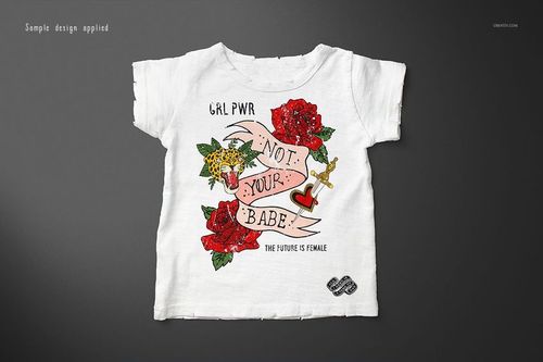 Front view of a white kids T-shirt with colorful graphic design, displayed on a dark background in a mockup scene.