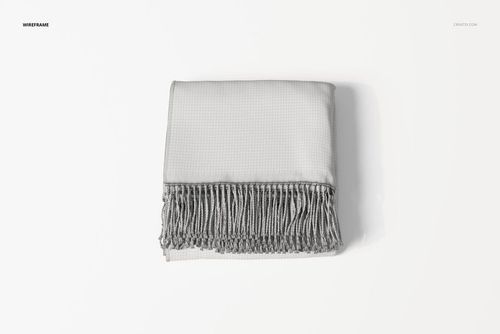 Folded throw blanket in light gray color with a subtle grid pattern and fringed edges, viewed from above on a white surface.
