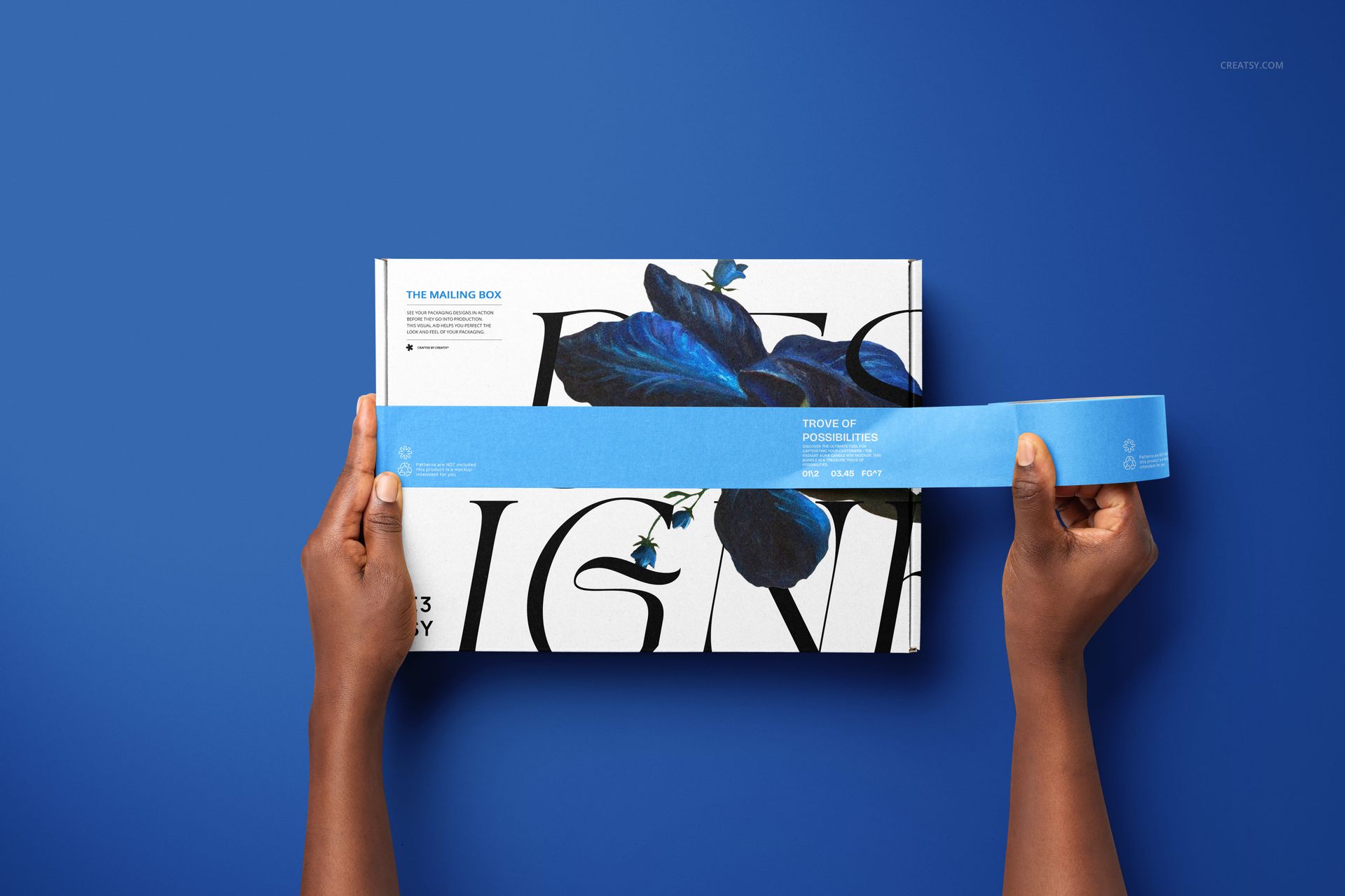 PSD mockup showing a mailing box with artistic typography and blue feather pattern, placed on a solid blue surface.