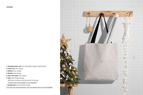 Woven tote bag mockup hanging on a wooden rack, shown from the front with neutral fabric and black handles.