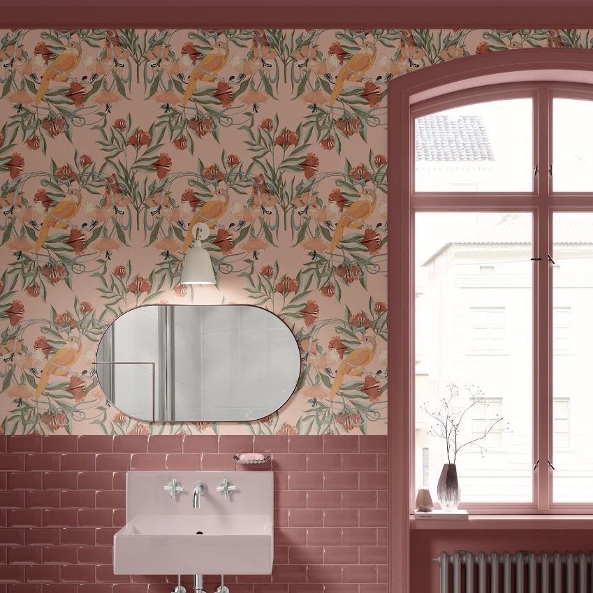 Vintage bathroom mockup featuring a pink sink, oval mirror, and floral botanical wallpaper with pink tile accents.