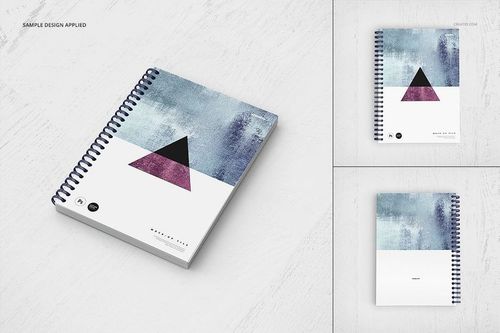 Spiral-bound notebook mockup with abstract geometric cover design, shown from angled and top-down perspectives on a light surface.