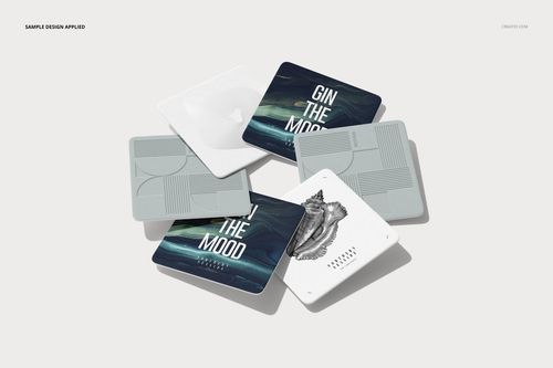 PSD mockup showing square drink coasters with different artistic designs and minimalist color tones.