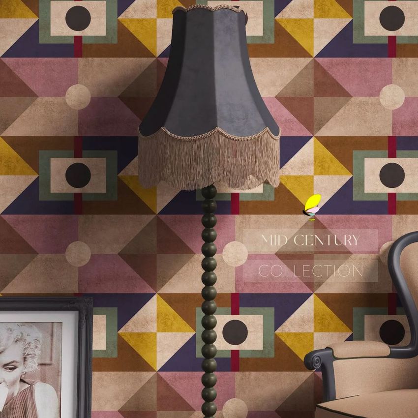 Fringed velvet lampshade mockup displayed on a vintage lamp in front of a colorful geometric wallpaper pattern.