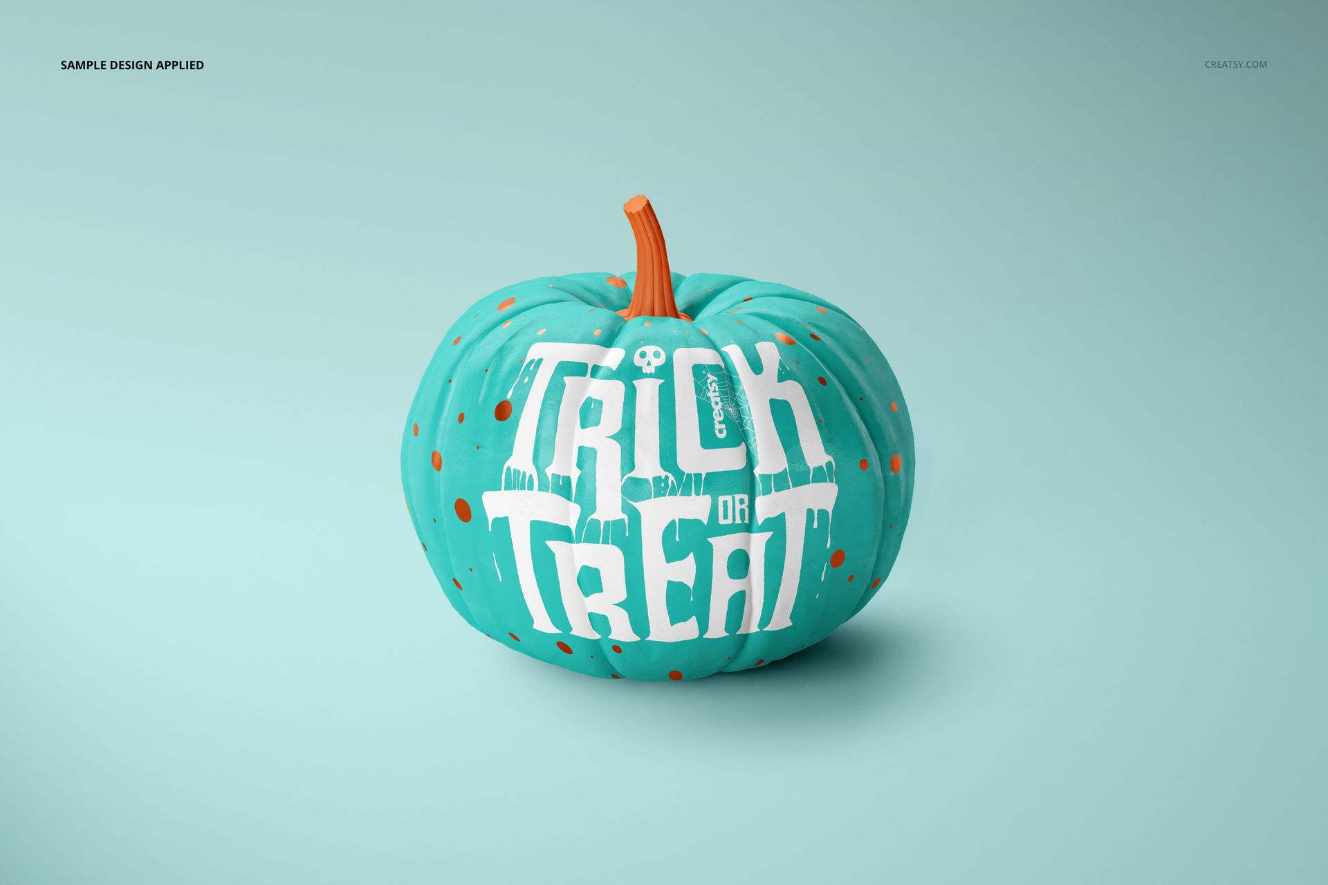 Halloween pumpkin mockup featuring a teal pumpkin with orange dots and bold white text, displayed on a plain surface.